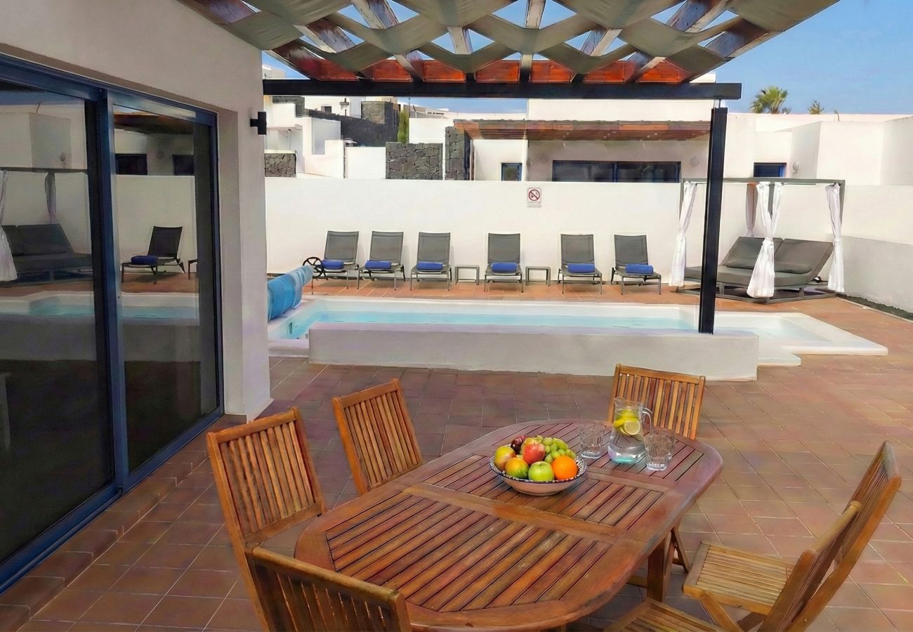 Wooden table set for dining on the terrace