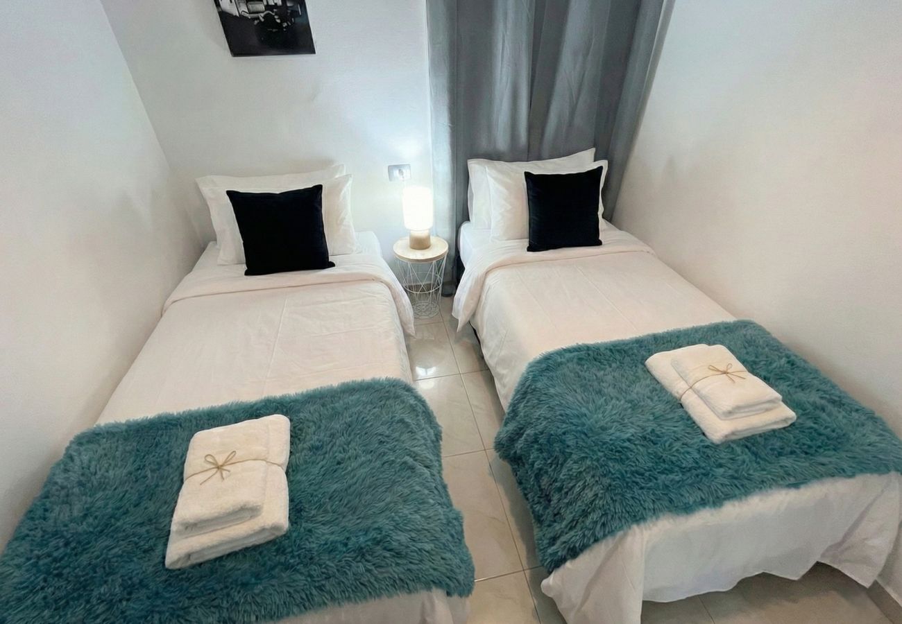 Overhead view of two single beds