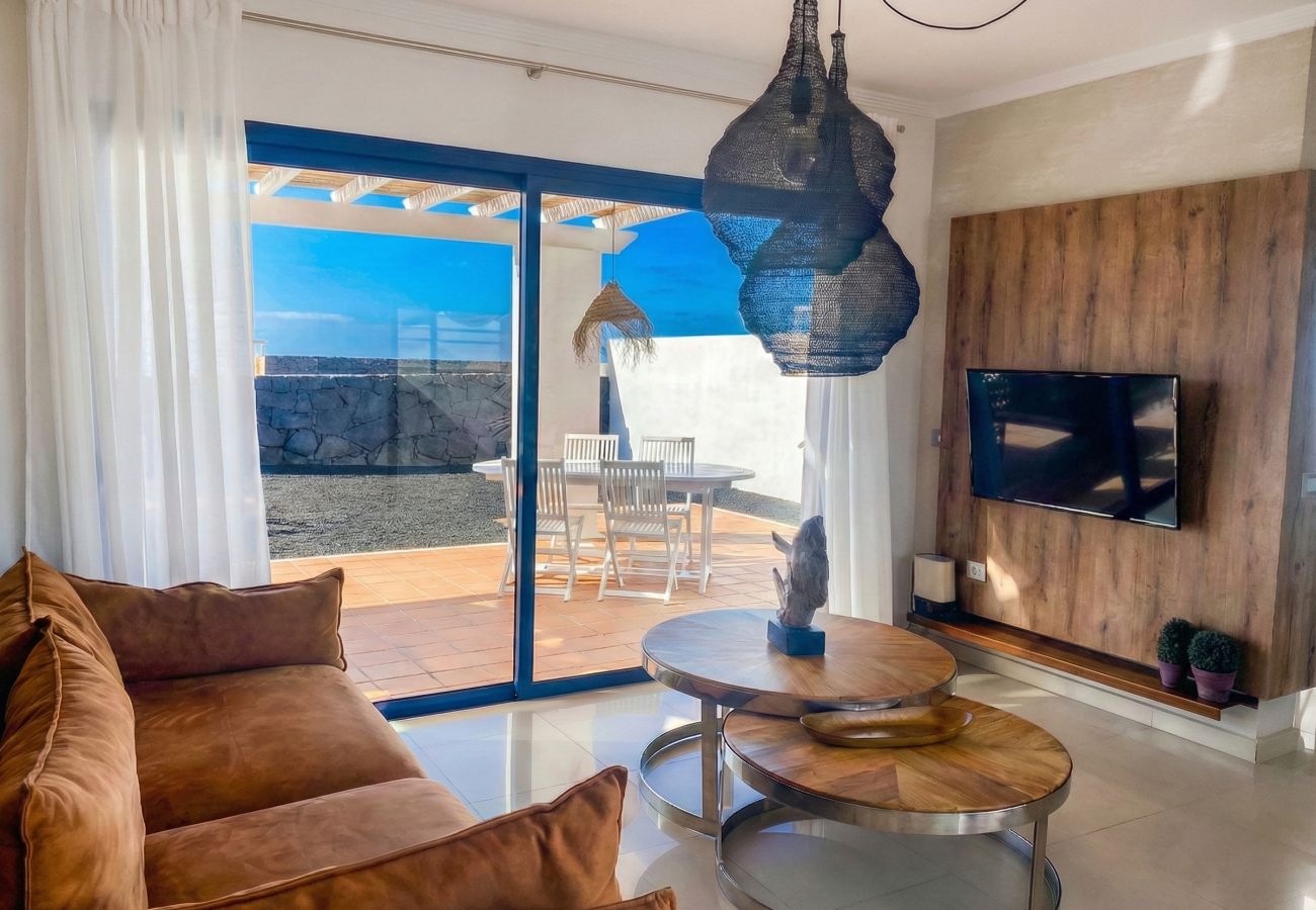 Living room interior with sliding doors open to the terrace