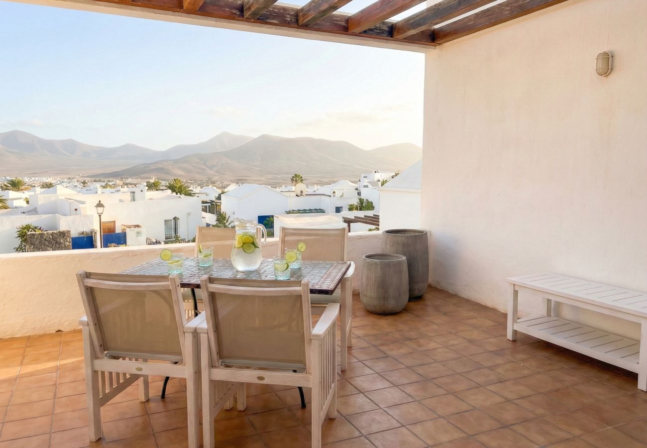Dining table on terrace with mountain views