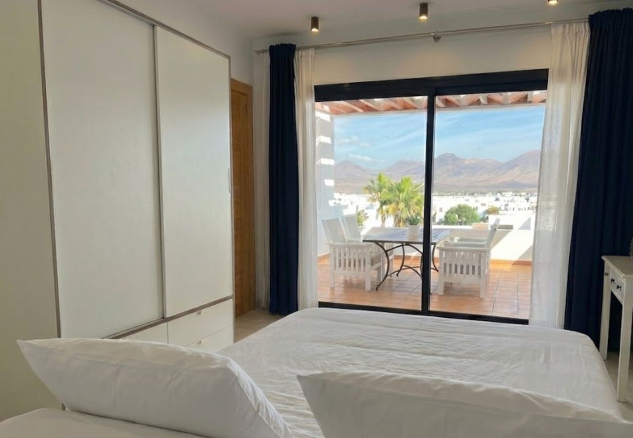 Bright bedroom with sliding doors at Villa Zaida