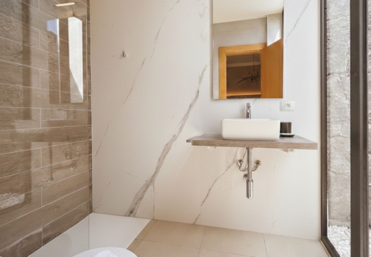 Detail of modern shower with marble tiles