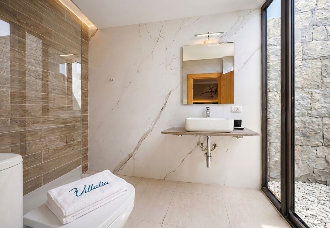 Detail of modern shower with marble tiles