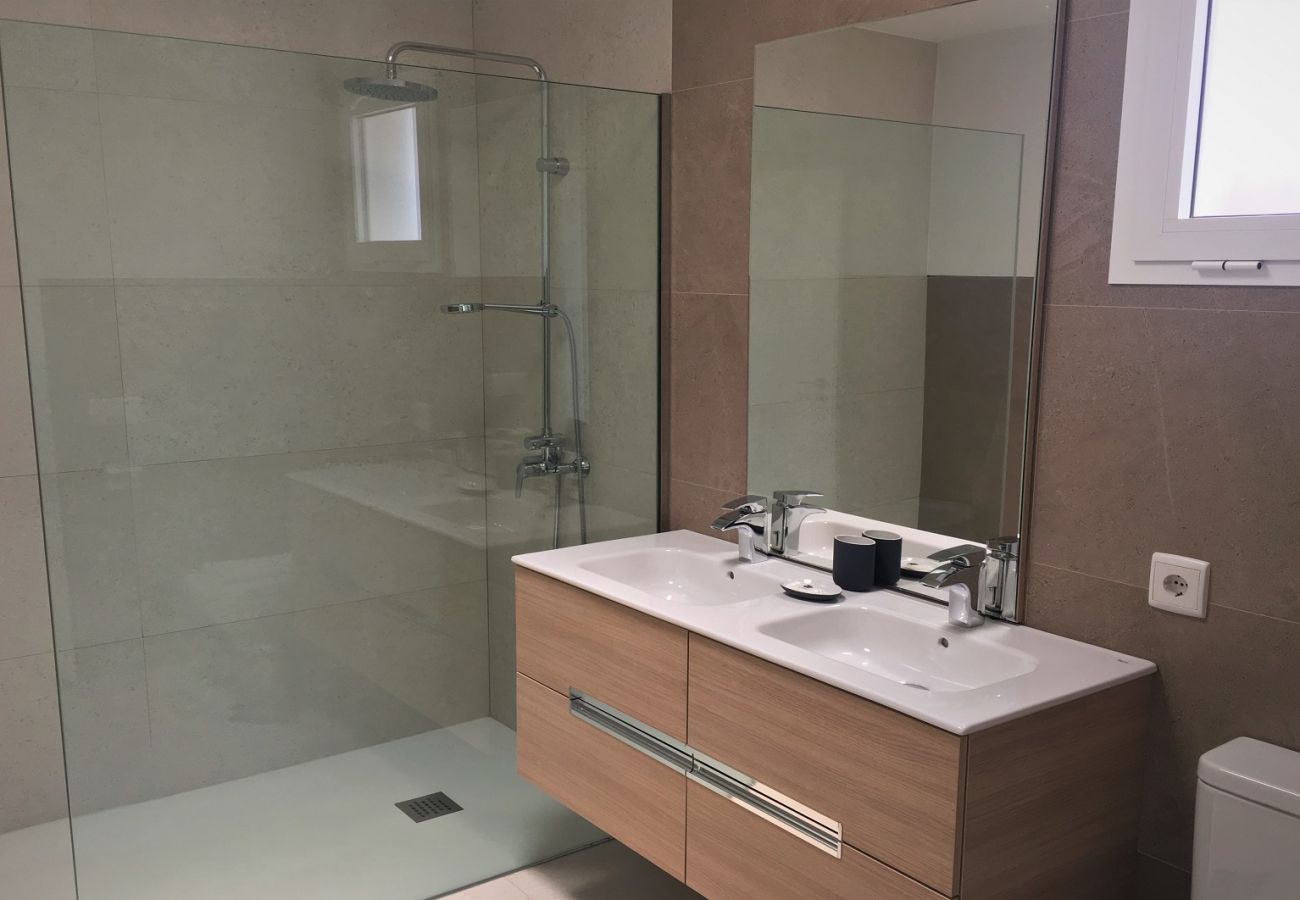 Bathroom with shower tray and glass partition holiday villa