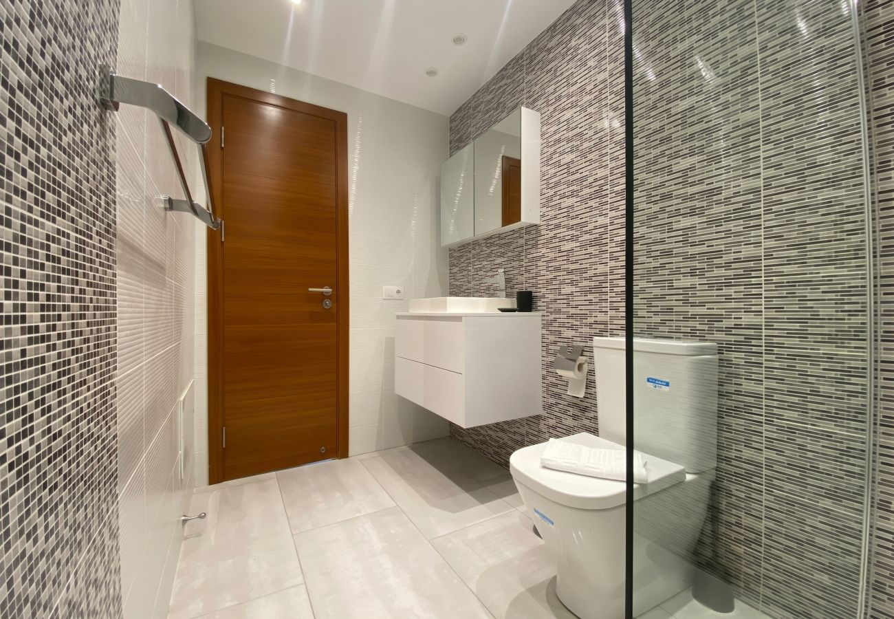 Shower with decorative tiles in bathroom of Villa Marina Lanzarote
