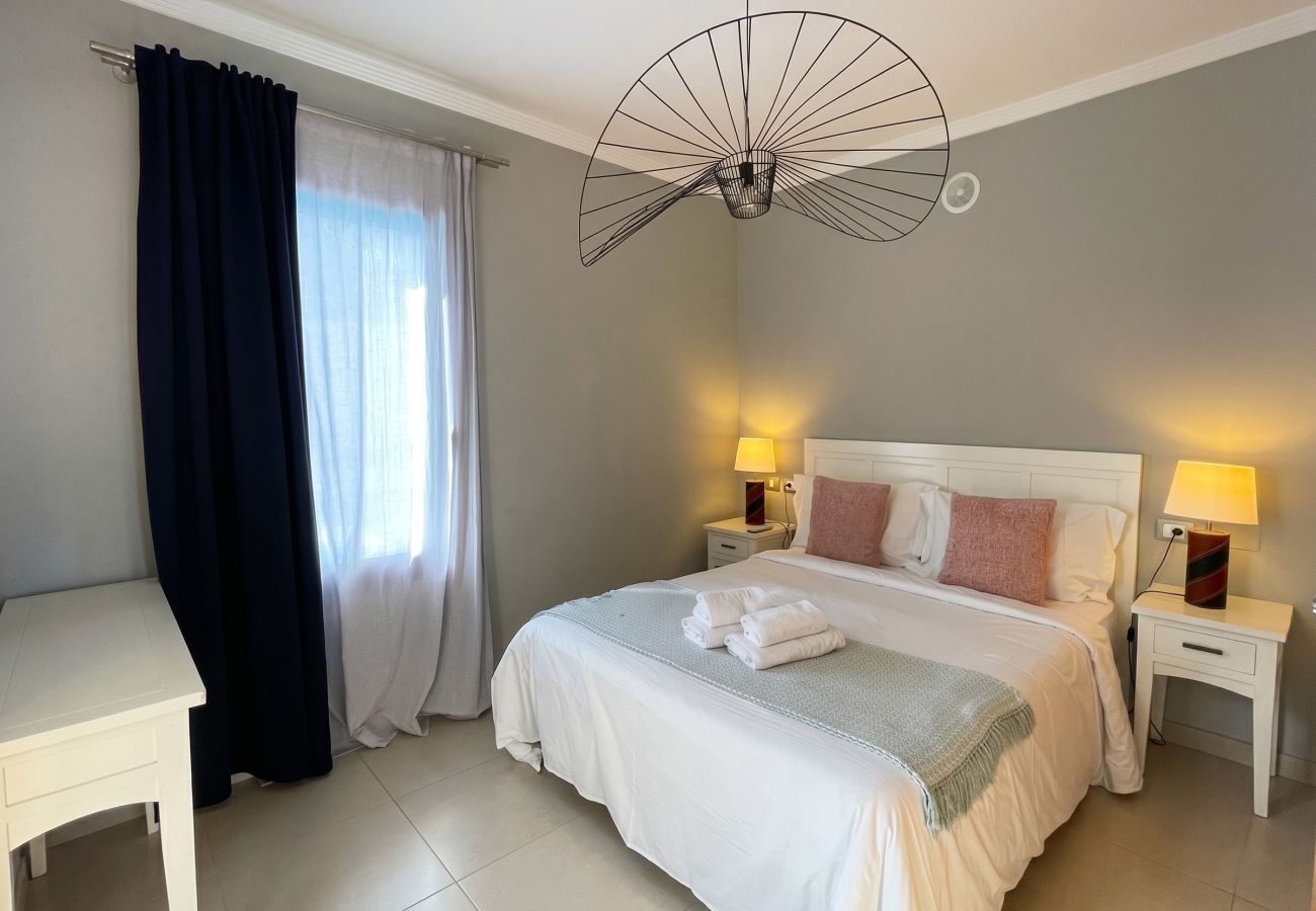 Modern master bedroom with a comfortable double bed.